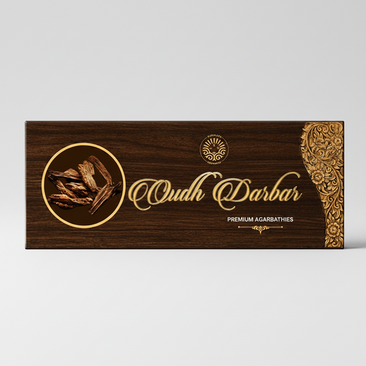 Wooden box with 'Oudh Darbar' branding and decorative elements on a white background